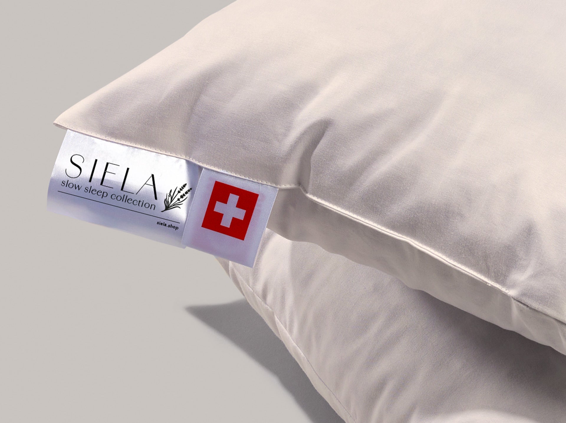 Die Etikette mit SIELA und dem Schweizer Kreuz von nahmen steht für Handarbeit in der Schweiz.